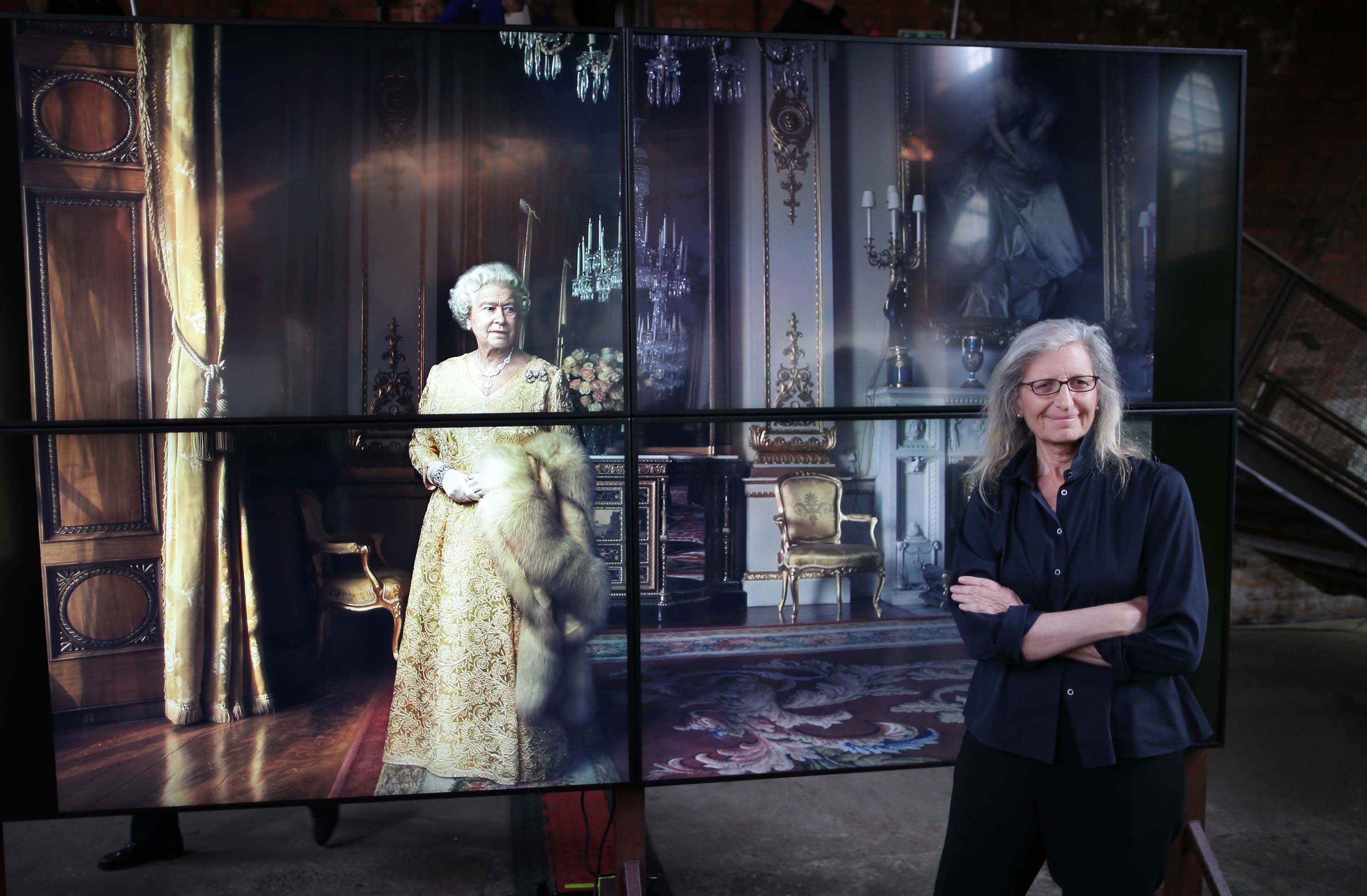 © Licensed to London News Pictures. This image is free to use ONLY in connection with the launch of the 'WOMEN: New Portraits' exhibition. 13/1/2016. London, UK. UBS and Annie Leibovitz launch 'WOMEN:New Portraits' at Wapping Hydraulic Power Station. Here Annie stands with an earlier portrait of Queen Elizabeth II. The exhibition opens to the public from Saturday 16th January until 7th February 2016. The newly commissioned photographs by the world renowned photographer will travel to 10 cities over the course of twelve months ñ London, Tokyo, San Francisco, Singapore, Hong Kong, Mexico City, Istanbul, Frankfurt, New York and Zurich. Access will be free to the public. Photo credit: Peter Macdiarmid.